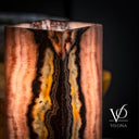 Close-up of natural Rosa Onyx with soft pink, cream, and translucent banding detail