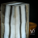 Close-up of natural Ice Onyx with cool white, gray, and translucent layered detail