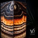 Close-up of natural Tangerine Onyx with warm orange, cream, and translucent banding detail