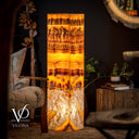 Close-up of natural Golden Cloud Onyx with warm gold, cream, and translucent flowing banding detail