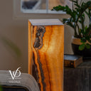Handcrafted 33.5-inch Aqua Onyx tower lamp lit from within to reveal warm translucent mineral layers