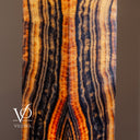 Natural Tangerine Onyx floor lamp glowing with strong vertical banding and a bold central formation