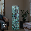 Luxury Fluorite floor lamp glowing with natural aqua, violet, cream, and crystalline mineral patterns
