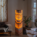 Handcrafted 59-inch Miami Sunset Onyx floor lamp glowing warmly in a luxury living room interior