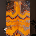 Miami Sunset Onyx tower lamp illuminated with dramatic centered V-shaped and symmetrical mineral formations