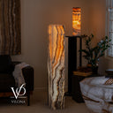 51.5-inch Tangerine Onyx floor lamp lit from within with dramatic natural stone layers and warm translucency