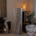 Natural Tangerine Onyx floor lamp with a slim rectangular profile and flowing vertical mineral lines