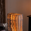 Vilona Onyx rectangular floor lamp illuminated, measuring 51.5 inches tall by 15.5 inches long