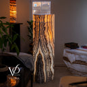 Illuminated Tangerine Onyx statement lamp with warm golden light and bold dark mineral lines