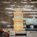 Decorative stone slab and elephant sculpture against a rustic wooden wall with Vilona logo.
