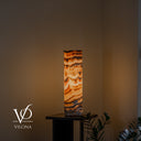 Vilona Onyx Sahara table lamp illuminated, measuring 19.75 inches tall by 5.5 inches in diameter