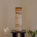 Sahara Onyx cylinder lamp photographed unlit to reveal natural beige, honey, and chocolate mineral layers