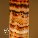 Sculptural Sahara Onyx accent lamp glowing warmly with layered natural mineral formations