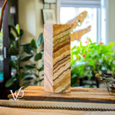 Marble block on a wooden stand with blurred indoor background