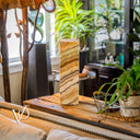 Decorative stone on a wooden surface with a blurred indoor setting