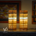 Two onyx stone lamps on a surface with 'Vilona' branding.