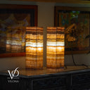 Two onyx table lamps on a wooden surface with 'Vilona' branding.