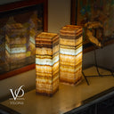 Two onyx stone lamps on a surface with 'Vilona' branding.