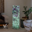 Illuminated Fluorite floor lamp with mint-green stone and deep purple banding concentrated near the top.