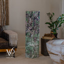 Front view of the unlit Fluorite tower with darker violet patterns above larger pale-green sections.