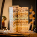 Marble-patterned lampshades on a wooden surface with blurred background