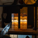 Two onyx table lamps on a wooden surface with 'Vilona' branding.