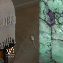 White inline on-and-off switch on the power cord beside the illuminated green Fluorite lamp.