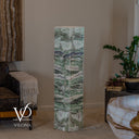 Unlit Fluorite floor lamp showing sage-green stone, white veining, and rippling gray and cream mineral bands.