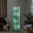 Glowing Fluorite tower with mint-green crystal textures, turquoise accents, and dark mineral lines across its polished faces.