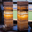 Two layered stone lamps with a blurred background, featuring the Vilona logo.