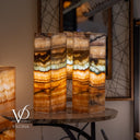 Decorative lamps with layered design on a table, featuring the brand 'Vilona'.