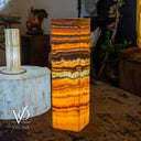 Decorative stone column with a patterned background featuring 'Vilona' branding.