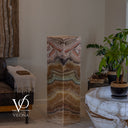 Unlit Aqua Onyx floor lamp showing polished faces with seafoam, cream, honey, and blush stone formations.