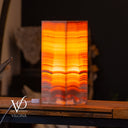 Miami Sunset onyx lamp shown illuminated with warm ambient lighting