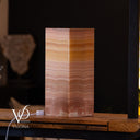 Close-up of natural movement and translucent banding in Miami Sunset onyx