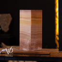 onyx lamp on a wooden surface with a blurred background