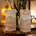 Two lamps with a decorative plant on a wooden table, featuring the Vilona brand.
