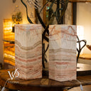 Two marble-patterned lamps on a wooden surface with 'Vilona' branding.