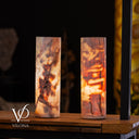 Divina Claire onyx table lamp pair illuminated with warm ambient light