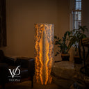 Full illuminated view of the Golden Cloud onyx floor lamp displaying its elongated central formation in a luxury interior.