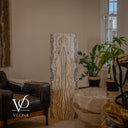Unlit view of the same Golden Cloud onyx floor lamp face showing ivory stone, charcoal outlines, and a tall central formation.
