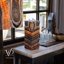 Front view of a square Tangerine Onyx table lamp with bright orange and dark layered banding