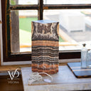 Natural Tangerine Onyx table lamp displayed unlit with its plug-in electrical cord