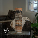Unlit rear view of a Tangerine Onyx table lamp with peach, cream, and charcoal stone layers and a visible power cord.