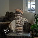 Unlit Tangerine Onyx cylinder lamp showing ivory swirls, peach bands, and deep charcoal and brown layers.