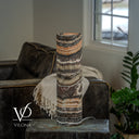 Unlit rear view of a Tangerine Onyx table lamp with cream and brown banding and a visible cord at the base.