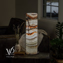 Glowing Light Tangerine Onyx cylinder lamp with ivory translucency and warm tangerine accents.