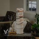 Light Tangerine Onyx cylinder lamp switched off, revealing creamy white stone with soft beige and gray layers.