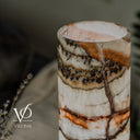 Close-up of Light Tangerine Onyx showing translucent white crystals, amber banding, and natural mineral activity.