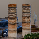Closer unlit view of Tangerine Onyx lamp pair, revealing ivory crystals, fine brown mineral markings and layered peach bands.
